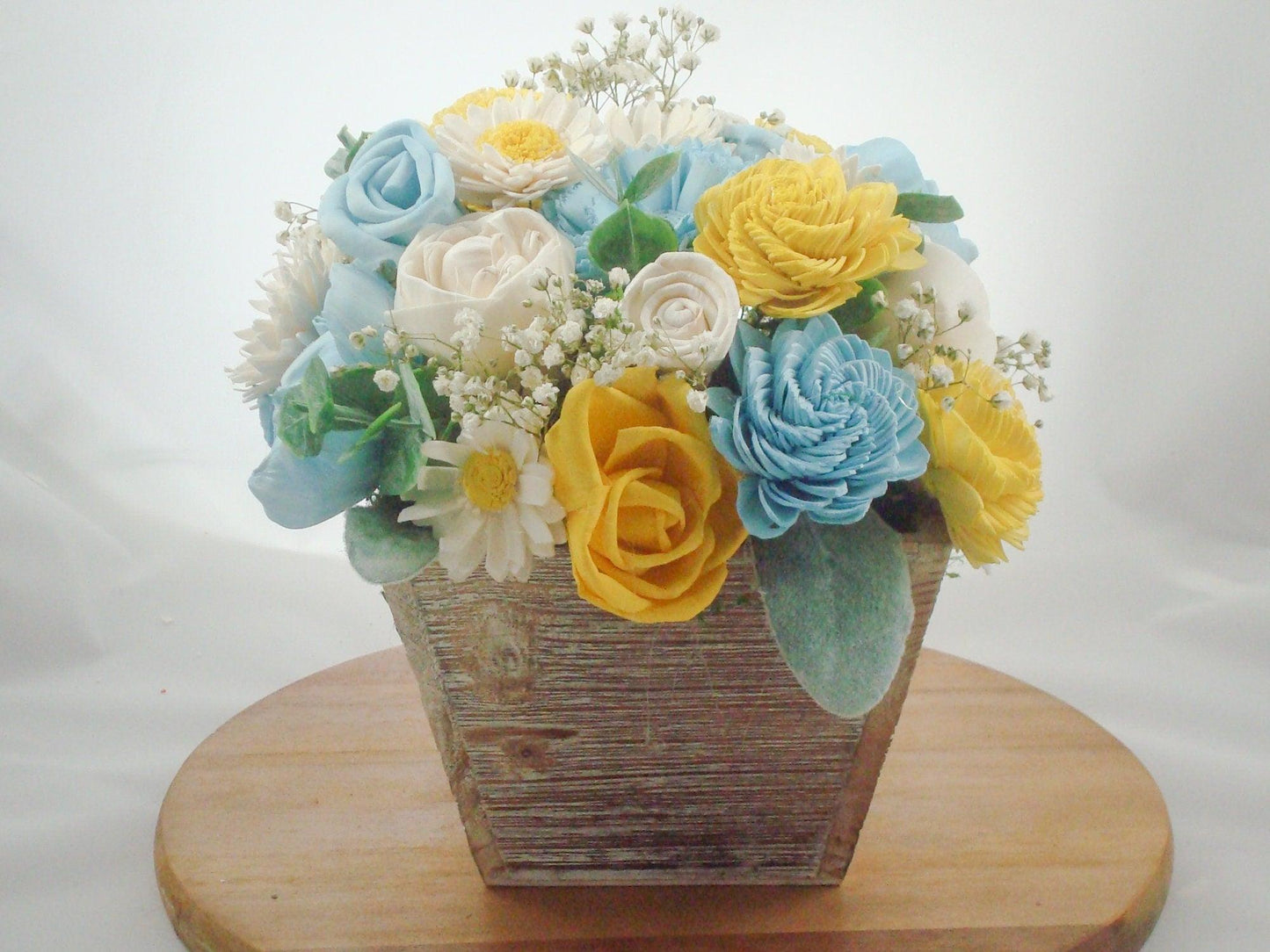 Centerpiece made from Sola flowers in blue and yellow. Perfect for a wedding or your home Keepsake arrangement that lives forever!