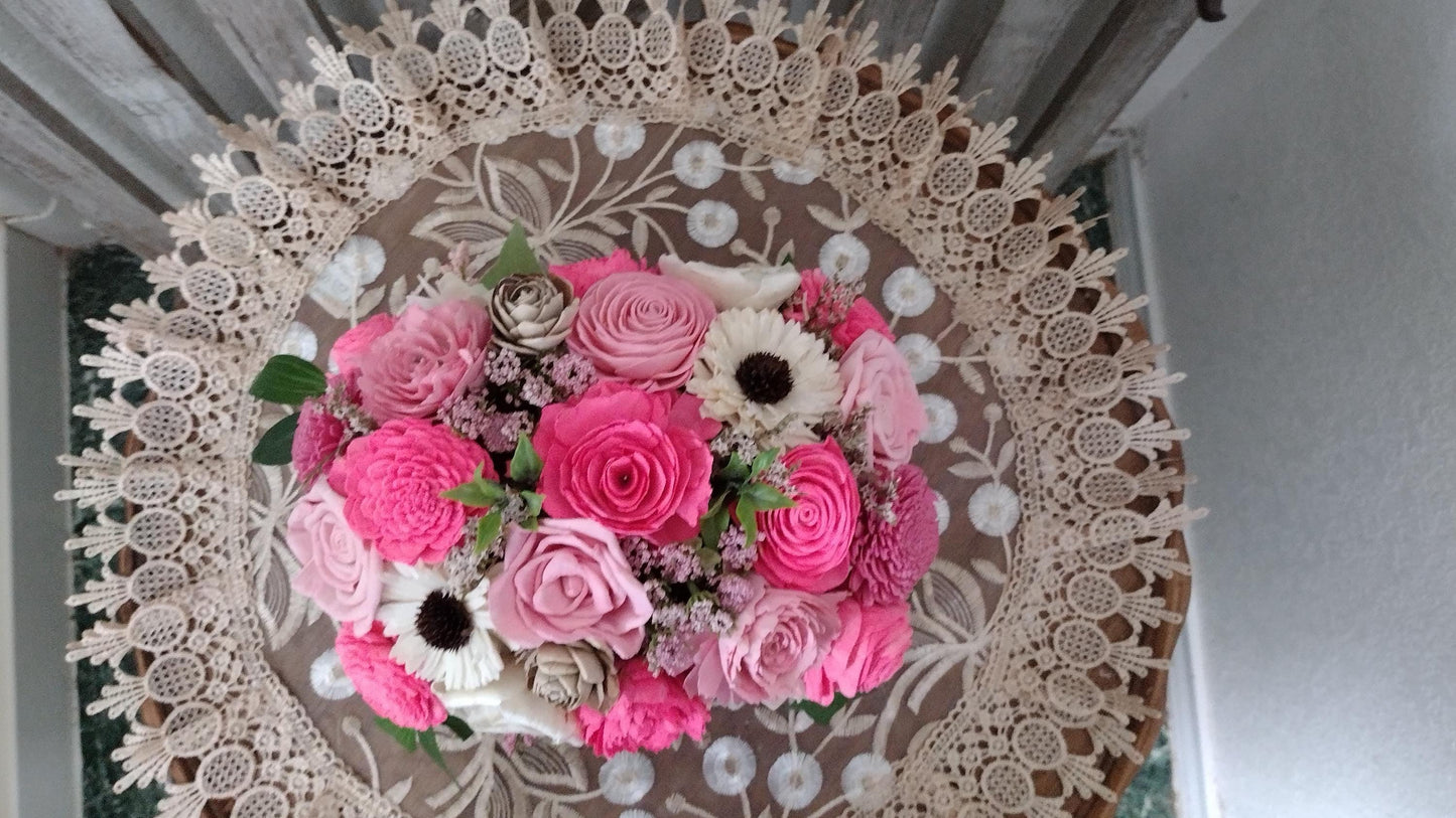 Centerpiece with hand dyed Sola flowers. Beautiful shades of pink wooden florals  in a galvanized container