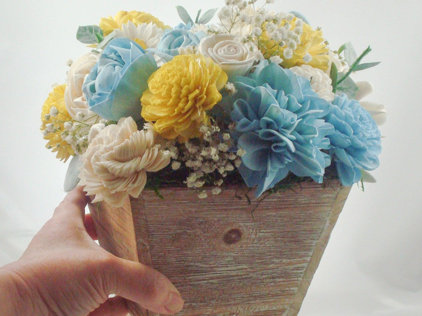 Centerpiece made from Sola flowers in blue and yellow. Perfect for a wedding or your home Keepsake arrangement that lives forever!