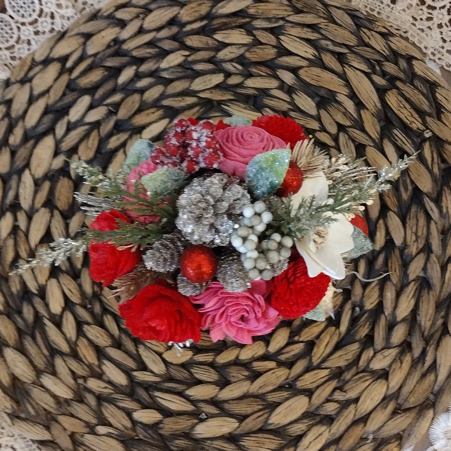 Pink and red holiday mug filled with wood flowers