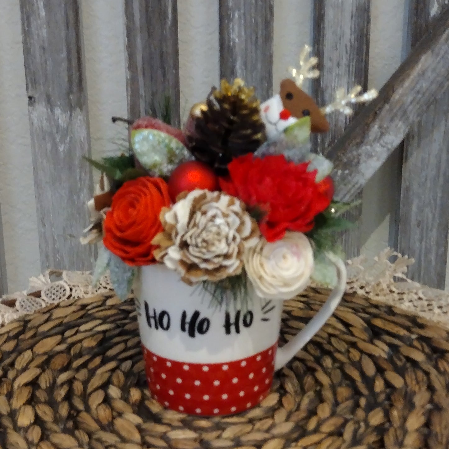 Christmas Ho Ho Ho Mug filled with sola wood flowers