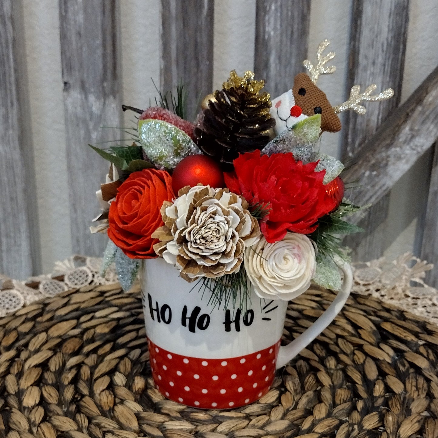 Christmas Ho Ho Ho Mug filled with sola wood flowers