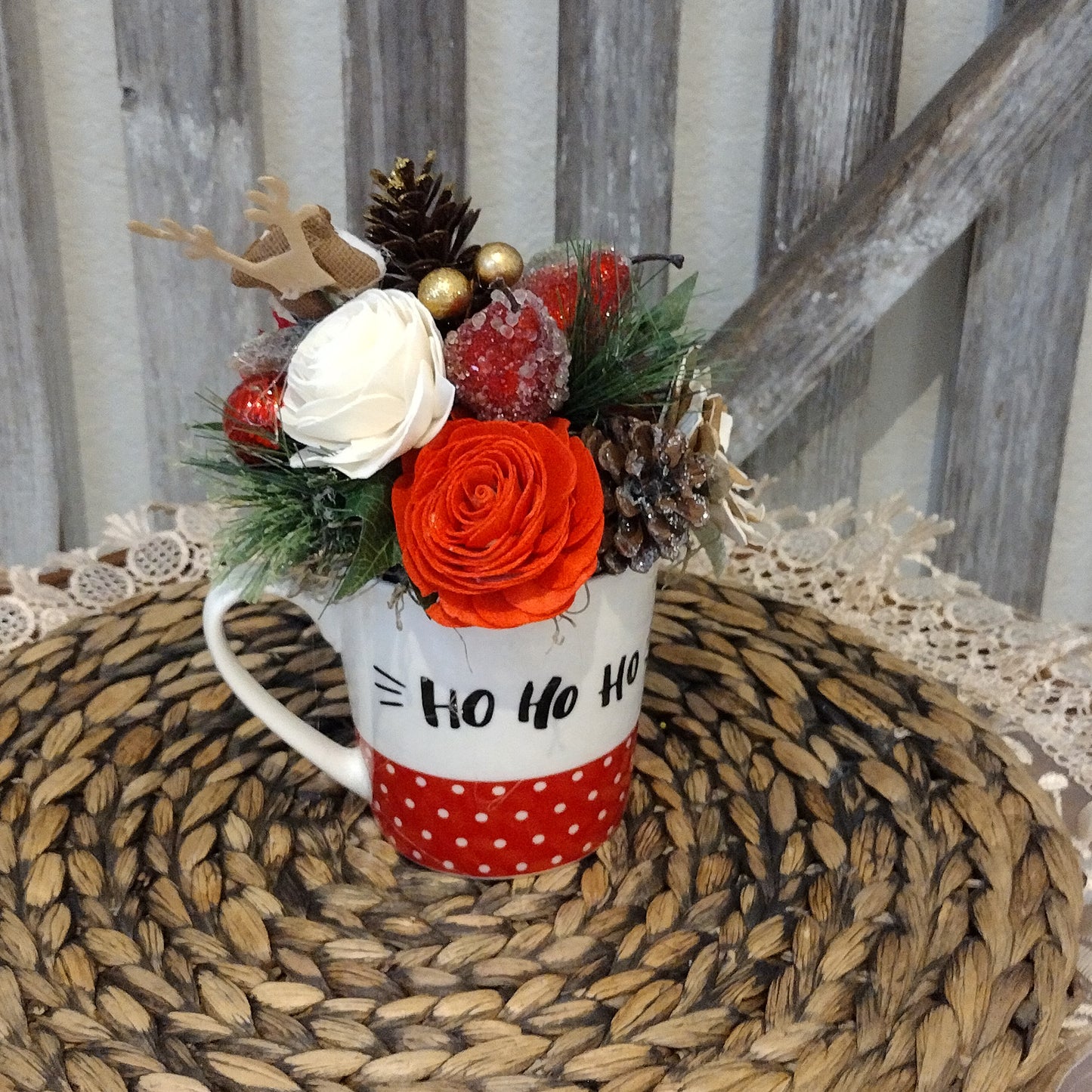 Christmas Ho Ho Ho Mug filled with sola wood flowers